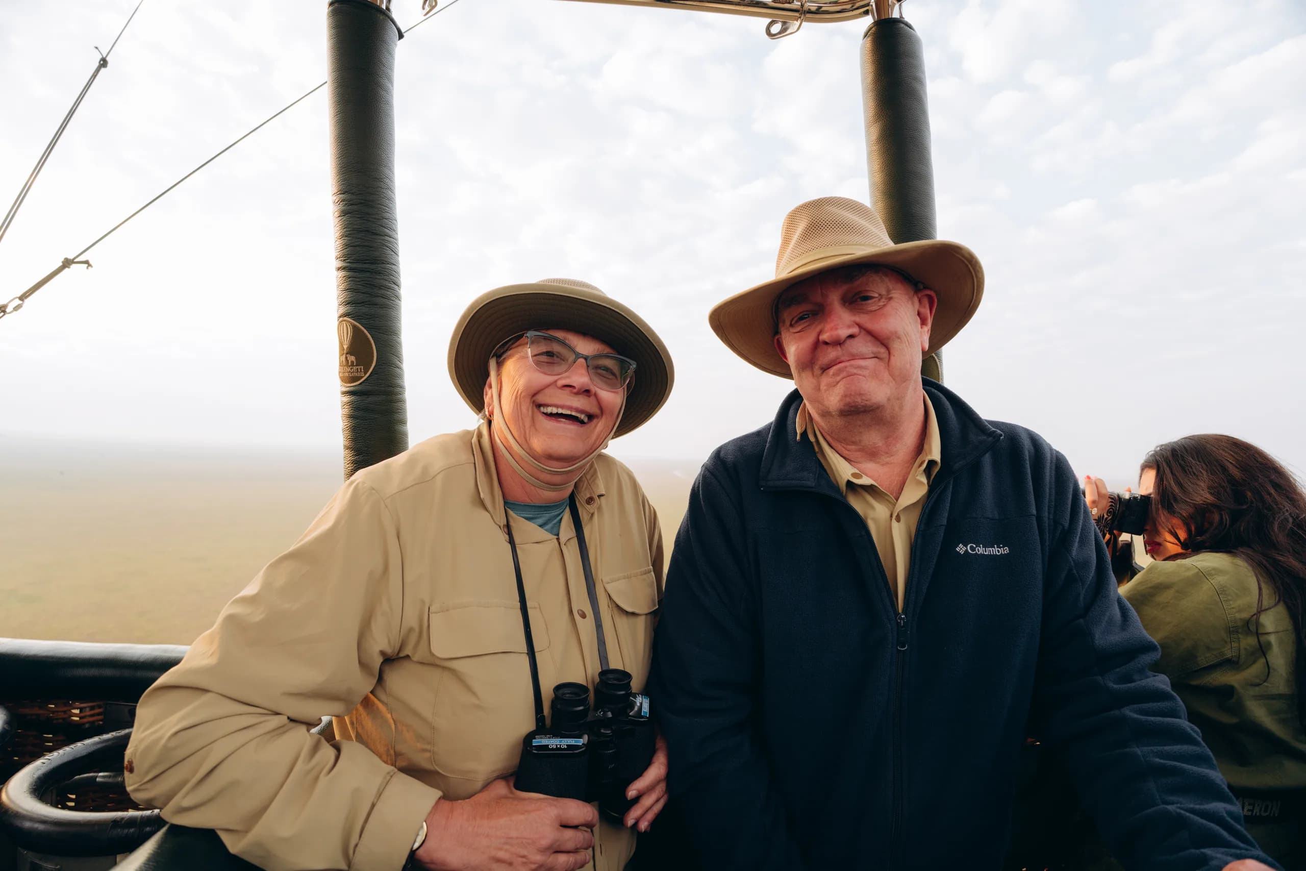 Guests in a hot air balloon over the plains